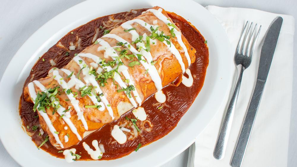 Wet Burrito · Burrito drenched in enchilada sauce and melted cheese.