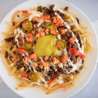 Super Fries · Fries covered with a choice of meat, cheese, sour cream, tomatoes, guacamole, and jalapeños.