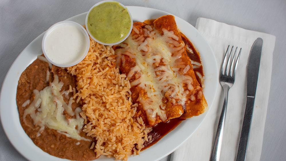 Enchilada Plate · Three enchiladas served with rice, beans, sour cream, and guacamole.