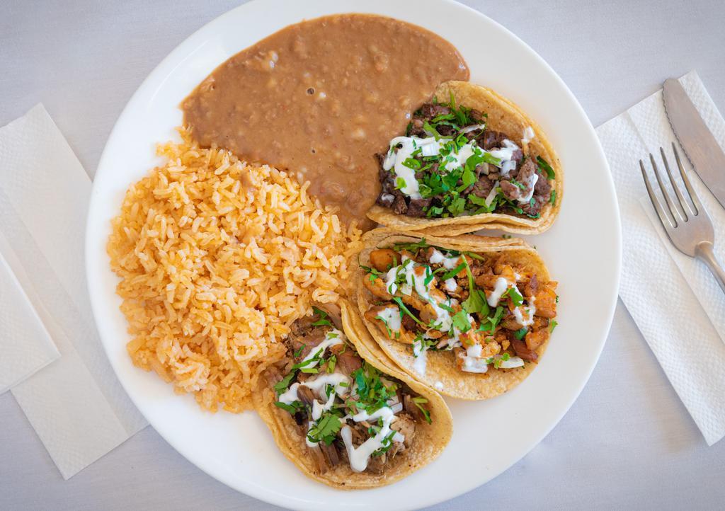 Taco Plate · Three regular tacos served with rice and beans.