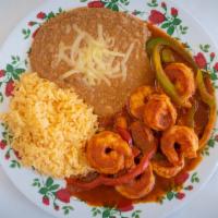 Camarones al Diabla · Chile shrimp served with rice and beans.