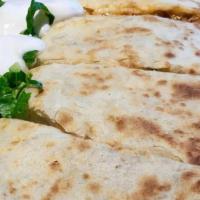 Chicken or Beef Quesadilla · Red enchilada sauce. All quesadillas are made with a 14” flour tortilla filled with melted c...
