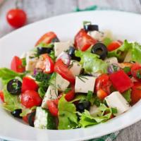 Greek Salad · Fresh salad mix with olives, feta cheese, tomatoes, onions and pepperoncini.