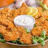 Ranch Chicken Tenders · Golden & crispy chicken tenders fried to a perfect crisp and smothered in delicious ranch sa...