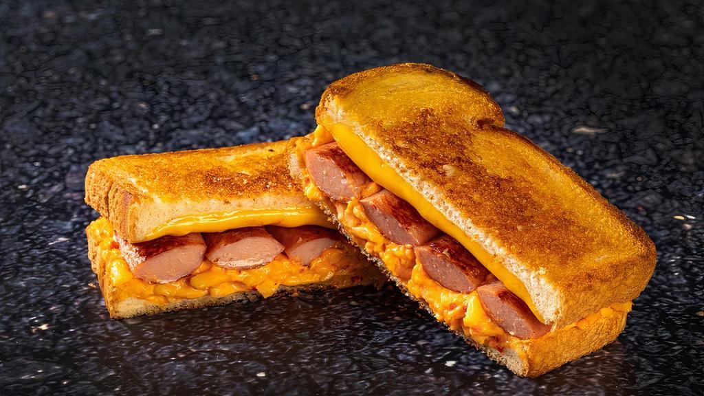 Talla-Mento Dogwich · All meat hot dog, split & griddled crisp, with pimento & American cheese on grilled white bread