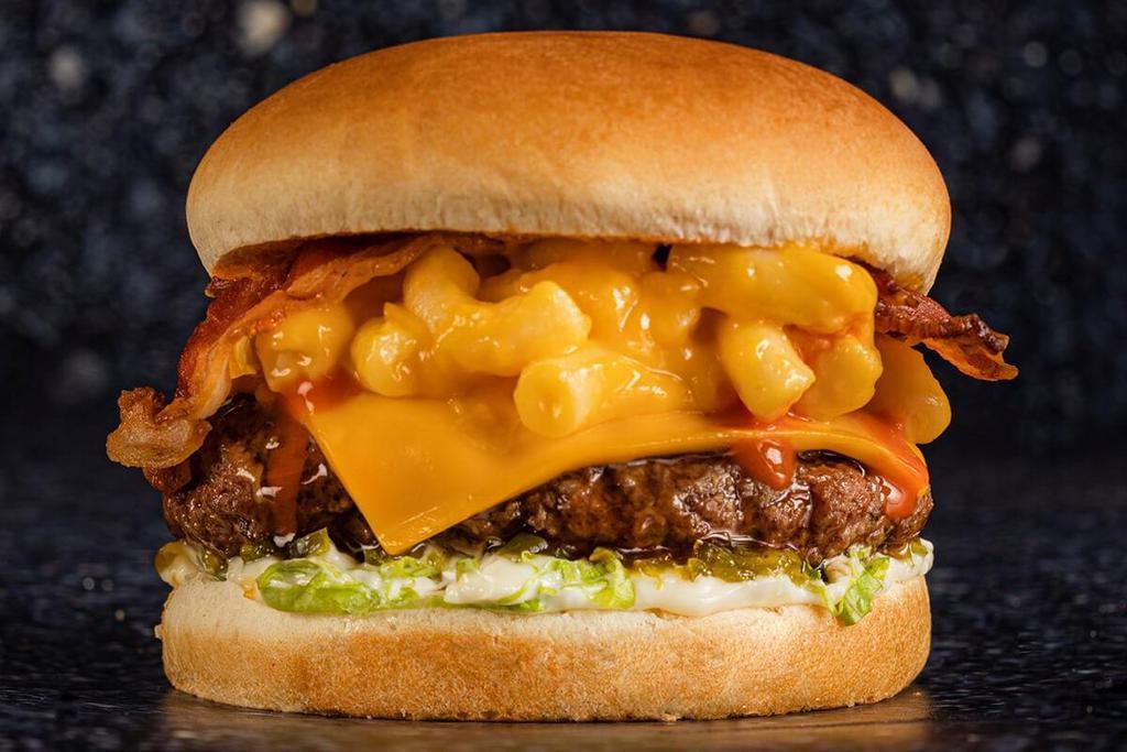 Refuel Burger · Beef patty with American cheese, bacon, mac & cheese, relish, lettuce, mayo & spicy buffalo sauce on a soft bun