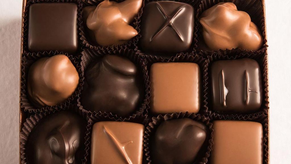12 Piece Assorted Chocolates · Smooth, luscious truffles and butter cremes, chocolate drenched almonds, cashews, pecans and macadamia nuts toasted to perfection, and rich slow-cooked caramels with and without nuts. This box also contains some of our sea salt caramels.