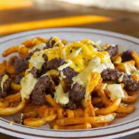 Loaded Burger Fries · Chopped beef patty on a bed of curly fries with American cheese, our special burger sauce, a...