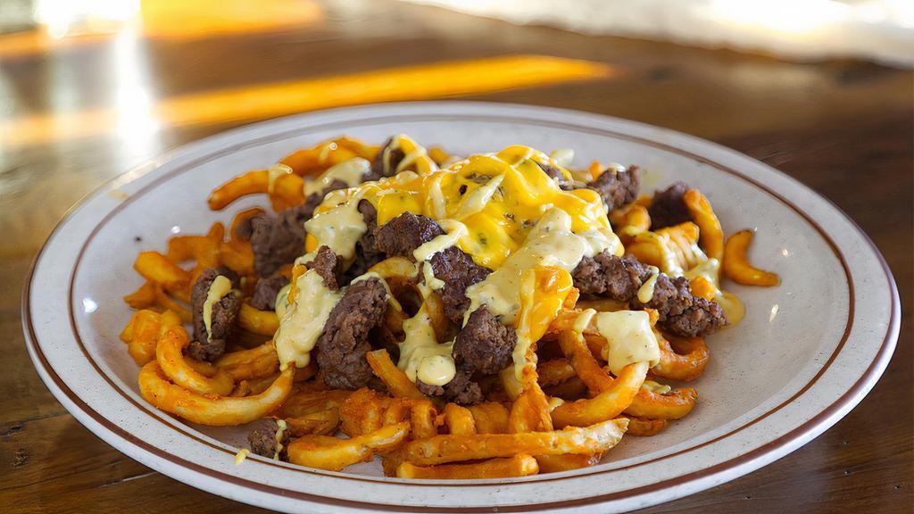 Loaded Burger Fries · Chopped beef patty on a bed of curly fries with American cheese, our special burger sauce, and grilled onions!