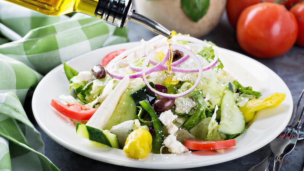 House Salad · Mix green, Tomatoes , Kalamata olive, herbs, feta cheese, cucumbers, olive oil.