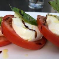 Mozzarela Caprese · fresh mozzarella, vine ripped tomatoes, basil, oregano, olive oil, and marinated olives