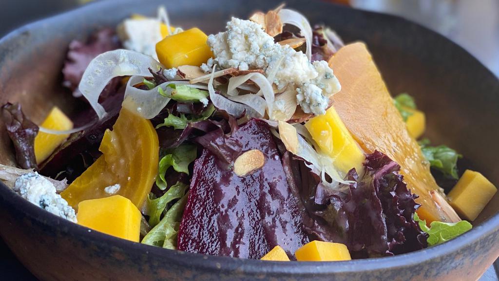 La Grotta Insalata · oven roasted red beets, fresh mango, mixed greens, mango and basil dressing, fennel, almonds and gorgonzola cheese
