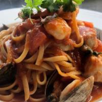 Linguini Pescatore · clams, mussels, calamari, prawns and salmon in marinara sauce or spicy arabiata