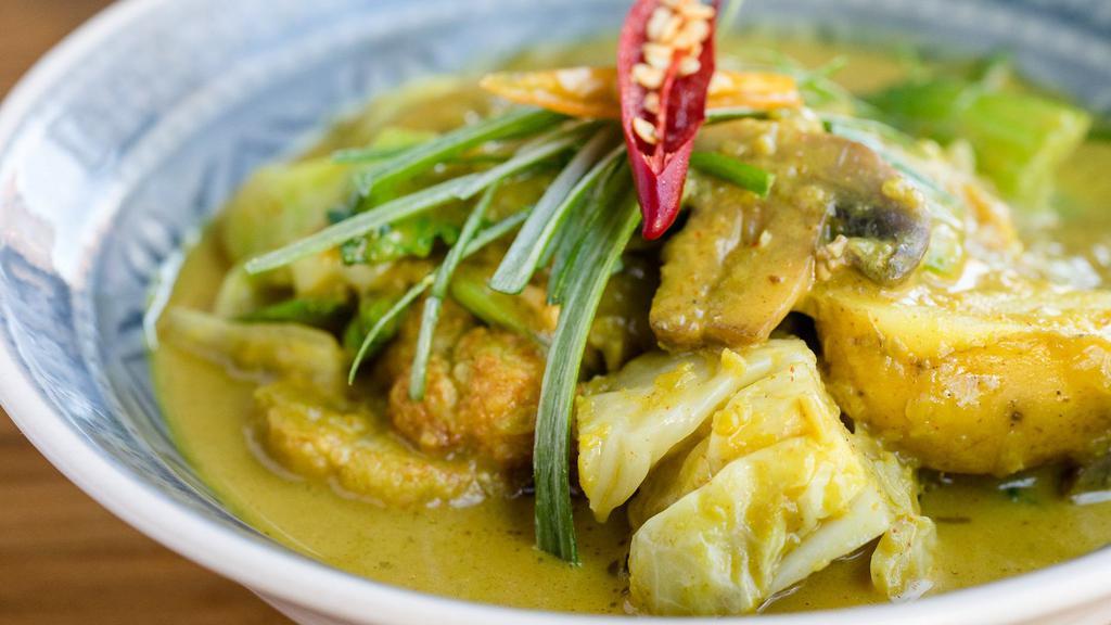 Coconut Veggie Curry · Gluten Free. Vegan. With bay leaves, cabbage, bok choy, mushrooms and marble potatoes.