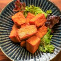 Spicy Crispy Tofu · Vegan, gluten-free. Fried Tofu, Sweet & Sour Hot Sauce, Thai Basil.