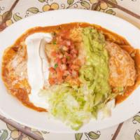 Burrito Mojado · Super burrito covered in choice of red or green sauce.