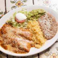 2 Enchiladas · Chicken, beef or pork red or green sauce.
