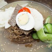Mul Naengmyeon 물냉면 · Buckwheat noodle served in cold broth with radish, cucumber, brisket and boiled egg.