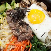 Hotstone Bibimbap 돌솥비빔밥 · In Hotstone - Rice topped with beef, assorted vegetables, and egg. (Rice, kimchi, radish kim...