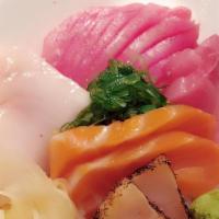 Rainbow Chirashi · Salmon, tuna, hamachi, butter fish, avocado, mango, seaweed salad, crab, tobiko and sushi ri...