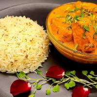Butter Chicken with Jeera Rice · Spicy creamy marinated chicken served with cumin basmati rice.