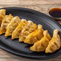 Gyoza · Eight pieces and veg fried potstickers.