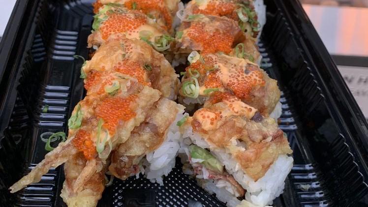 7. Spider Man Roll · Inside: unagi, crab meat, avocado, cucumber on top with house sauce, unagi sauce, tobiko green onion, and fried soft shell crab.