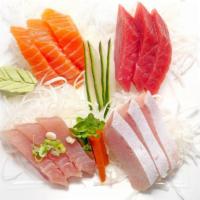 Sashimi Deluxe · Three pieces of salmon, three pieces of tuna, three pieces of hamachi, and three pieces of c...