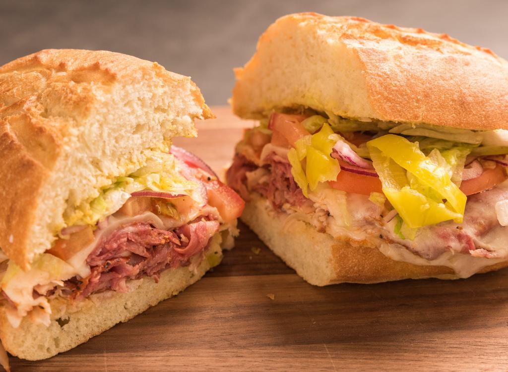 San Franciscan · smoked pastrami, slow roasted turkey, melted provolone, crunchy lettuce, tomato, red onion, pepperoncini, mayo, mustard on white roll