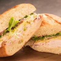 Cranturkey · slow roasted turkey, swiss, sprouts, leaf lettuce, mayo, cranberry compote on wheat roll