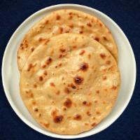 Tandoori Roti · Whole wheat Indian bread cooked in a clay oven.
