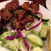 Chicken Tikka Kabab · Boneless chicken piece marinated in yogurt; herbs & spice baked in tandoor.
