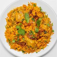 Chicken Biryani · Basmati rice with chicken, herbs & spices.