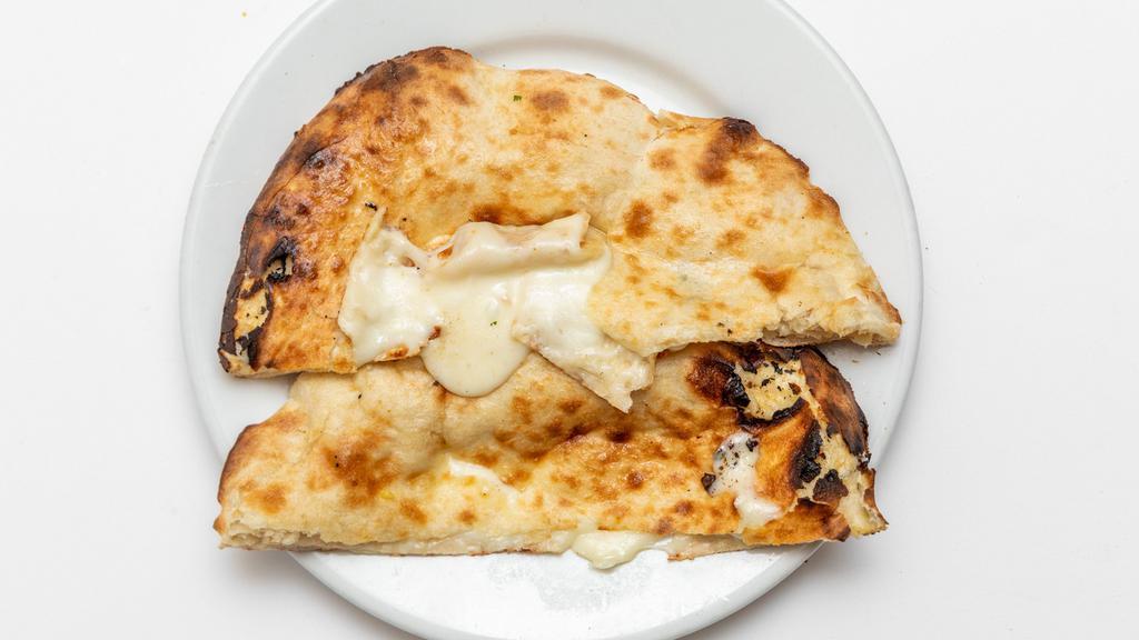 Cheese Naan · Soft bread stuffed with cheese freshly baked in tandoor.