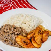 Rice & beans with Dodo (Plantain) · Topped with red bell pepper stew.