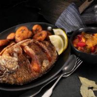 Whole Tilapia Fish & Dodo (Plantain) · Topped with mixed bell pepper sauce.