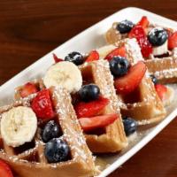 Waffle Special · Waffle with fresh fruit, two eggs, choice of one hot link, two bacon strips or country sausa...