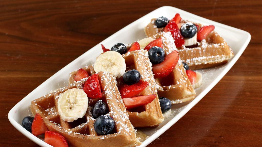 Waffle Special · Waffle with fresh fruit, two eggs, choice of one hot link, two bacon strips or country sausage patty.