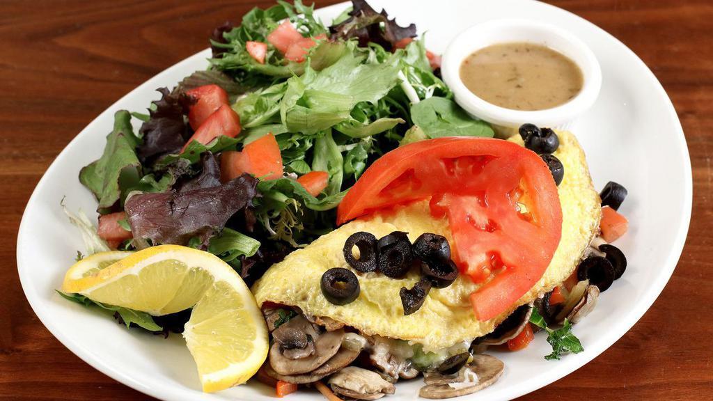 Veggie Omelette · Kale, spinach, mushrooms, tomatoes, onions, bells, black olives, avocado and Jack.