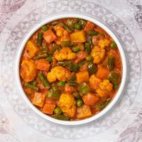 Vegetarian Korma · Mixed vegetables cooked with onions, tomatoes, and aromatic spices cooked in creamy sauce.