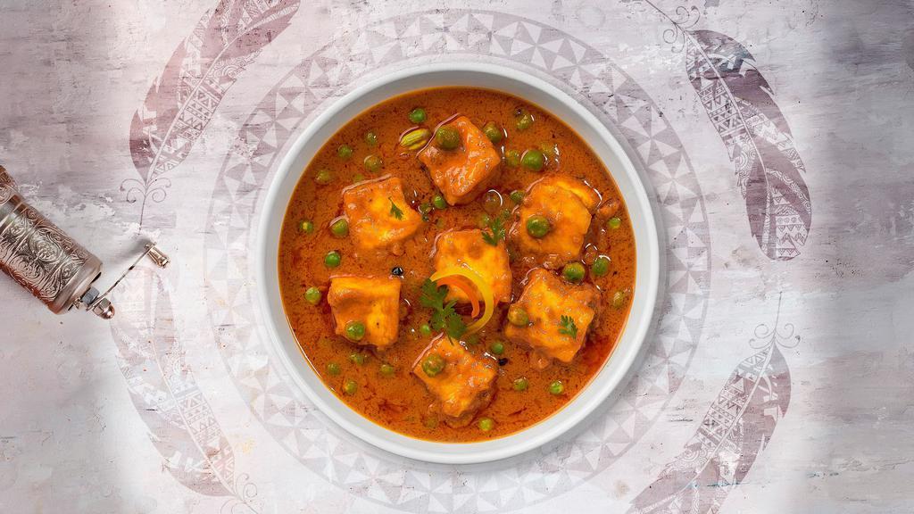 Matar Paneer · Cubes of fresh cottage cheese and green peas cooked in a creamy tomato gravy.
