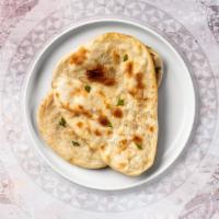 Cheese Naan · Freshly baked bread in a clay oven garnished with cheese.