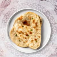 Keema Naan · Freshly baked bread in a clay oven garnished with  ground beef.
