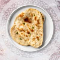 Chili Cheese Naan · Freshly baked bread in a clay oven garnished with chili and cheese
