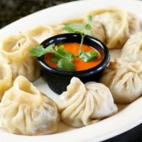 Veg Momo (7 Pieces) · Steamed dumplings filled with minced cabbage, spinach, mushroom, cashew nuts, cheese, onion,...