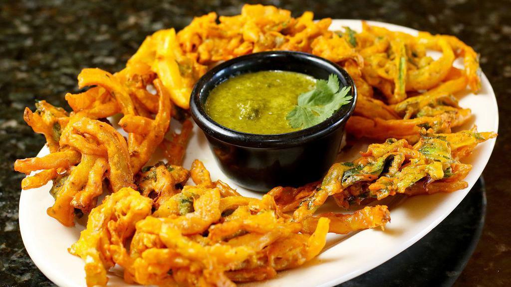 Veg Pakora (5 Pieces) · Vegan. Mixed golden-fried vegetable fritters. Served with mint sauce.