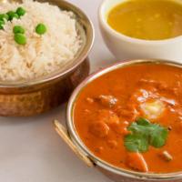 Butter Chicken · Premium chicken is cooked in the tandoor and then cooked in a creamy butter.