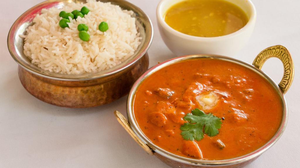 Butter Chicken · Premium chicken is cooked in the tandoor and then cooked in a creamy butter.