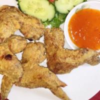 A1. Cánh Gà Chiên Bỏ (4) · Deep fried chicken wings.