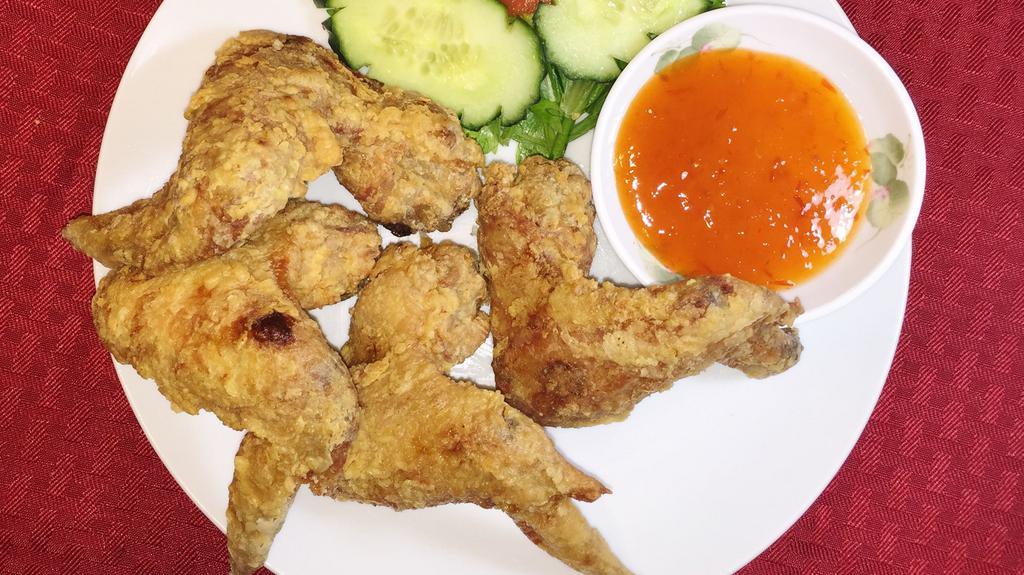A1. Cánh Gà Chiên Bỏ (4) · Deep fried chicken wings.